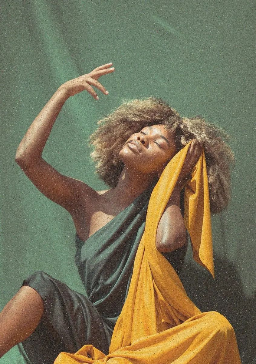Woman dancing with a yellow fabric